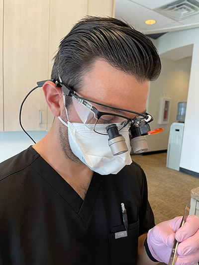 Dr. Friedman expertly crafting a dental implant for a patient at Boulder Smile Design