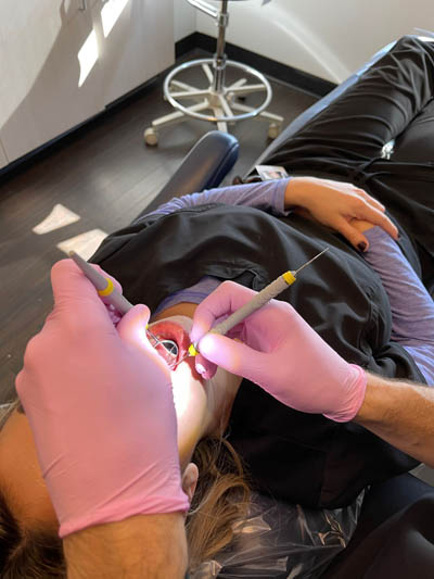 a patient receiving painless oral surgery at Boulder Smile Design